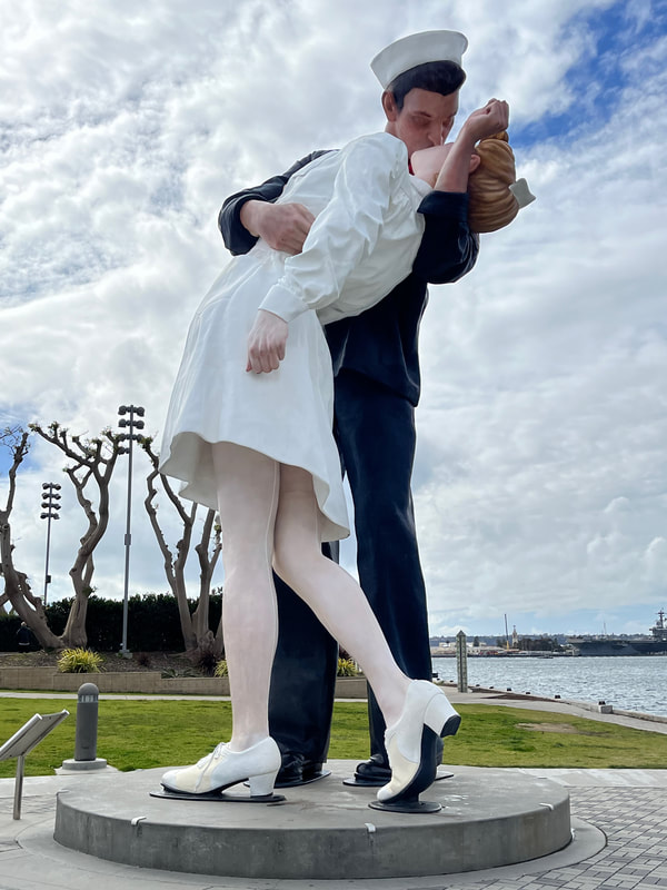 The Kissing Statue beside USS Midway